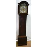 An oak longcase clock, the 8 day movement striking on a bell, the 12 inch brass and silvered dial