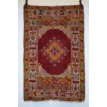 Konya rug, central Anatolia, early 20th century, 5ft. 2in. x 3ft. 4in. 1.58m. x 1.02m. Overall wear;