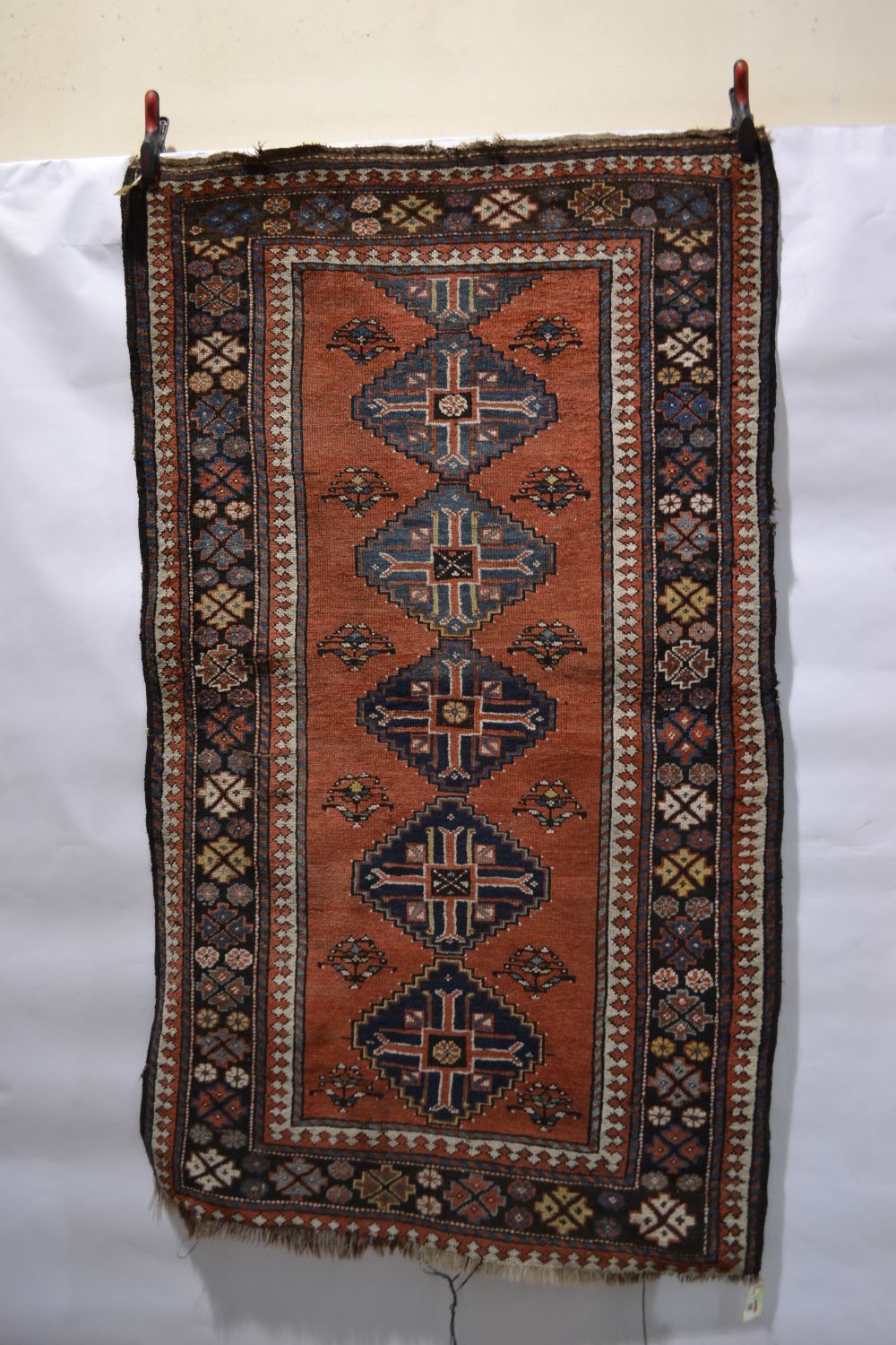 Kurdish rug, north west Persia, circa 1920s-30s, 6ft. 5in. x 3ft. 9in. 1.96m. x 1.14m. Overall wear;