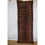 Kurdish long rug, north west Persia, early 20th century, 9ft. 9in. x 3ft. 4in. 2.97m. x 1.02m.