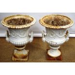 A pair of Victorian Coalbrookdale cast iron garden urns, the campana shape bodies with raised
