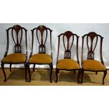 A suite of four late Victorian mahogany parlour side chairs, inlaid stringing, the pierced splat