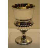 A George III silver wine goblet, the campana shape bowl partly ribbed with a girdle moulding, gilded