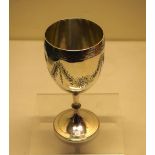 A Victorian silver wine goblet, the bowl engraved stars and swags of foliage, a bright cut border,