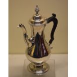Hester Bateman. A George III silver coffee pot, the baluster body with a cast spray swan neck spout,