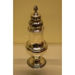 A George III silver baluster sugar caster, with cable borders having an engraved pierced fretwork
