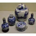 A Chinese porcelain blue and white ginger jar, decorated a family relaxing in a garden, with foliage