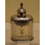 A George II silver tea caddy, with chased rococo decoration to the shoulders and pull off cover,