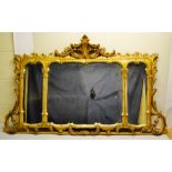A mid nineteenth century English carved giltwood Rococo Revival landscape overmantle mirror, with