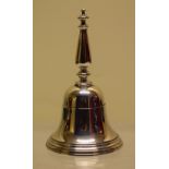 A silver bell, with a cast baluster handle. 4.25in (11cm) Makers mark overstruck by Brook & Son (