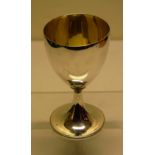 A George III silver wine goblet , the bowl with a patch inset, the interior gilded, on a beaded edge