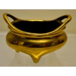 A Chinese small polished bronze censer, with two lifts on three feet, six character seal mark of the