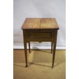 A late Victorian faded mahogany patent mechanical writing table, the twin flap hinged opening top