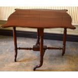 An early Victorian mahogany Cumberland table, the serpentine drop leaf top on turned legs and gate