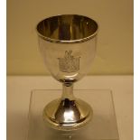 A Victorian silver literary prize goblet, engraved a coat of arms, on a pedestal foot, the base