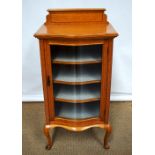 A late Victorian satinwood veneered and satin walnut display cabinet, inlaid stringing, the top with