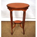 An Edwardian satinwood oval occasional table, the quarter veneered top inlaid ebony stringing to the