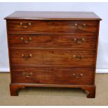 An early nineteenth century mahogany veneered chest, the cross banded top above four long