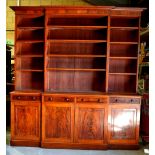 An early Victorian mahogany breakfront library bookcase, the top with a reeded edge detachable