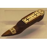 An early nineteenth century Napoleonic war vintage wooden shoe, having a bone decorated pierced