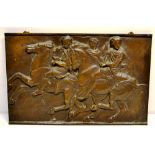 A nineteenth century bronze casting of a classical wall plaque, depicting a Greek horseman and two