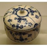 A French eighteenth century blue and white porcelain bowl and cover, decorated flowers with ribbed