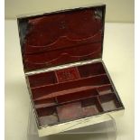 An Edwardian travelling writing box, fitted out in red leather and encased in silver, with a