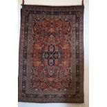 Tabriz rug, north west Persia, circa 1940s-50s, 6ft. 9in. X 4ft. 6in. 2.05m. X 1.37m. Rust red field