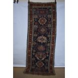 Karaja runner, north west Persia, early 20th century, 10ft. 5in. X 3ft. 11in. 3.17m. X 1.20m.