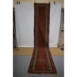 Hamadan runner, north west Persia, circa 1920-30s, 16ft. X 3ft. 1in. 4.88m. X 0.94m. Overall wear,