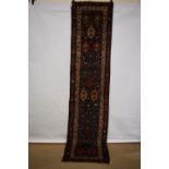 Kurdish runner, north west Persia, circa 1920s, 10ft. 11in. X 2ft. 6in. 3.33m. X 0.76m. Some wear;