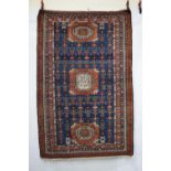 Interesting Hamadan rug with ivory inscribed gul to centre, north west Persia, first quarter 20th