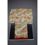 Spectacular Japanese wedding kimono, circa 1967, brocaded in bright silks and gold coloured metal