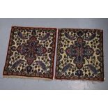 Pair of Kashan mats, west Persia, circa 1930s-40s, each 2ft. 5in. X 2ft. 1in. 0.74m. X 0.64m. Some