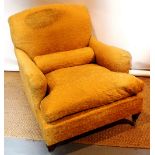 A late Victorian Howard & Sons easy armchair, upholstered in gold coloured figured material with