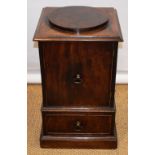 A George III mahogany pedestal urn stand, the top with a raised rondel, fitted a cupboard door above