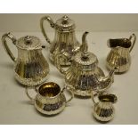 A small Victorian silver five piece Brunswick pattern tea and coffee service, the crested ogee sides