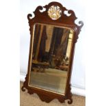 A mahogany veneered fret frame mirror, in mid eighteenth century style, the glass with an etched