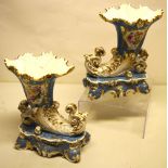 A pair of mid nineteenth century Jacob Petit porcelain cornucopia vases, painted panels of