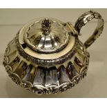 A George IV silver mustard pot, the fan fluted outswept body with a chased repousse band of roses, a