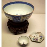 A Chien Lung late eighteenth century Chinese porcelain punch bowl, decorated figures in a garden and