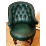 A Victorian tub shape study armchair, upholstered in bottle green button back leather, on front