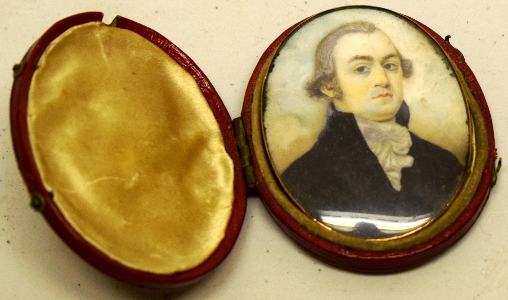 A Regency portrait oval miniature on ivory, of a gentlemen cleric, the gold back later fitted as a