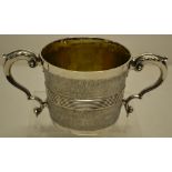 An unusual George III silver cup, the body with frosted effect and a reeded girdle moulding, two