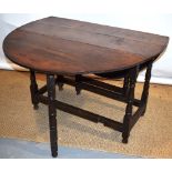 A late seventeenth century oak gateleg table, the oval drop leaf top on a frame with baluster turned