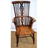 An early nineteenth century Thames Valley beech and ash windsor high back armchair, with vertical