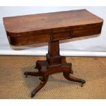 A George IV faded rosewood veneered card table, the 'D' shape swivelling fold over flap top, lined