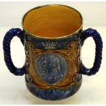 An Edwardian Royal Doulton stoneware commemorative cup, for the Centenary of Lord Nelson's death