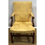 A George III mahogany writing chair, the upholstered back with open padded arms to a stuffed over