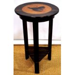 A French Art Deco occasional table, veneered in maccaser ebony, the circular crossbanded top